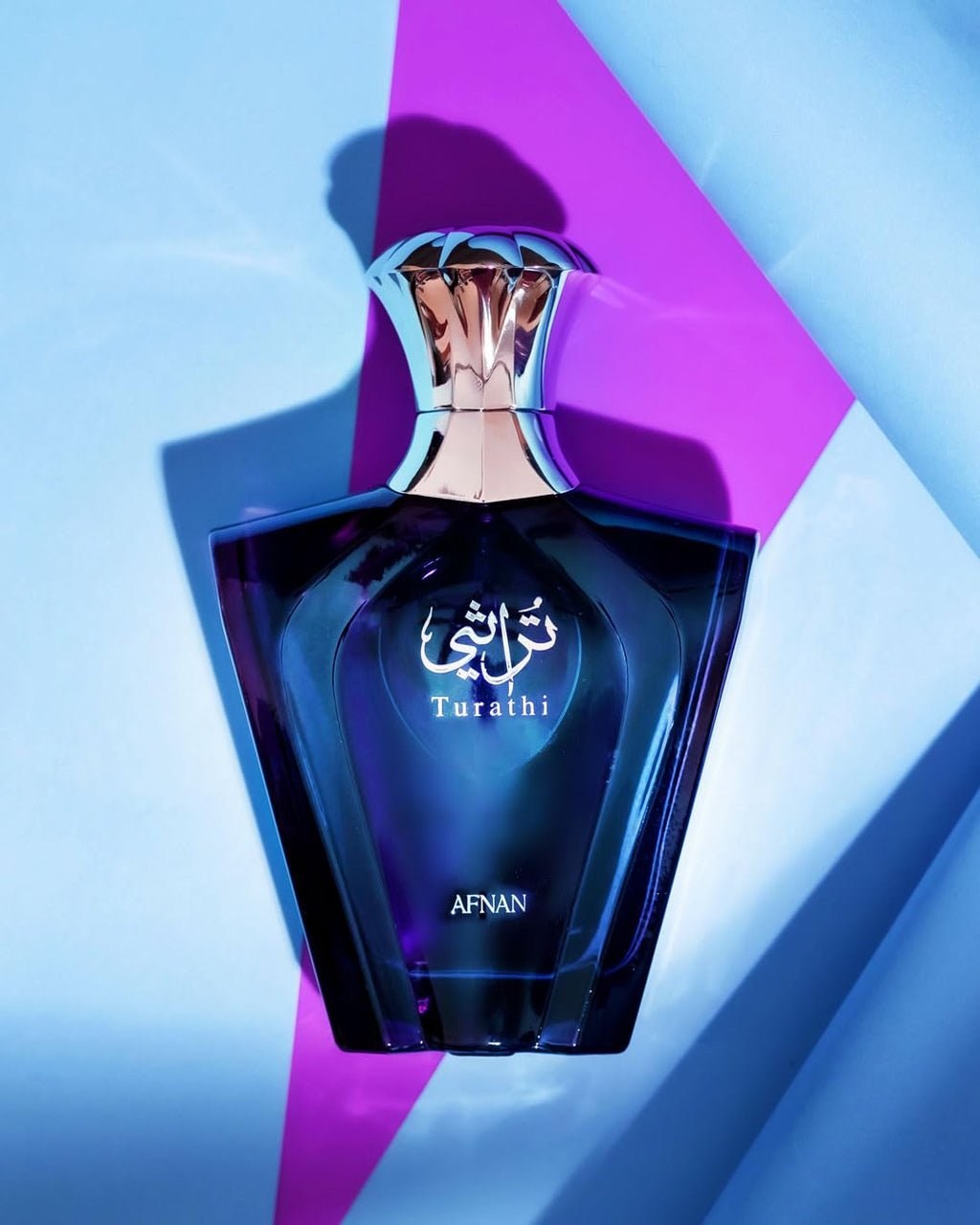 Afnan Turathi Blue luxury men's perfume bottle with a sleek design, showcasing woody and fresh fragrance notes.