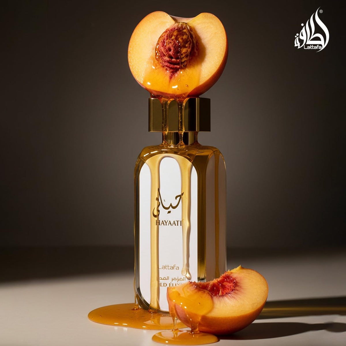 Lattafa Hayaati Gold Elixir perfume bottle, luxury unisex fragrance by Hub Wavy, 3.4 ounces, rich and long-lasting scent.