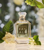 Hub Wavy Kayali Huda Beauty Deja Vu White Flower perfume bottle, luxury long-lasting woody fresh fragrance for women.