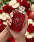 Hub Wavy Kayali Eden Juicy Apple perfume bottle for women, 3.4 oz, featuring a sleek design and fruity apple scent.