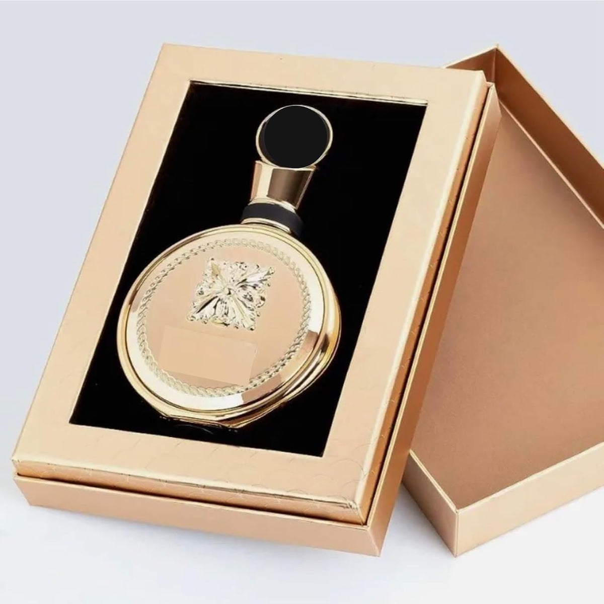Hub Wavy Lattafa Fakhar Gold Extrait perfume bottle, luxurious unisex fragrance in a 3.4 fl oz/100 ml container.