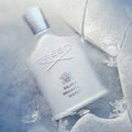 Creed Silver Mountain Water unisex perfume bottle, 3.3 oz / 100 ml, with sleek silver design and clear glass showcasing the fragrance.