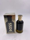 Hugo Boss BOSS Bottled Absolu Intense men's fragrance bottle, 3.3 oz, with sleek glass design and black cap.