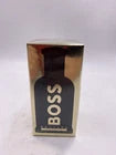 Hub Wavy Hugo Boss BOSS Bottled Absolu Intense men's fragrance 3.3 oz bottle, sleek glass design and elegant packaging.