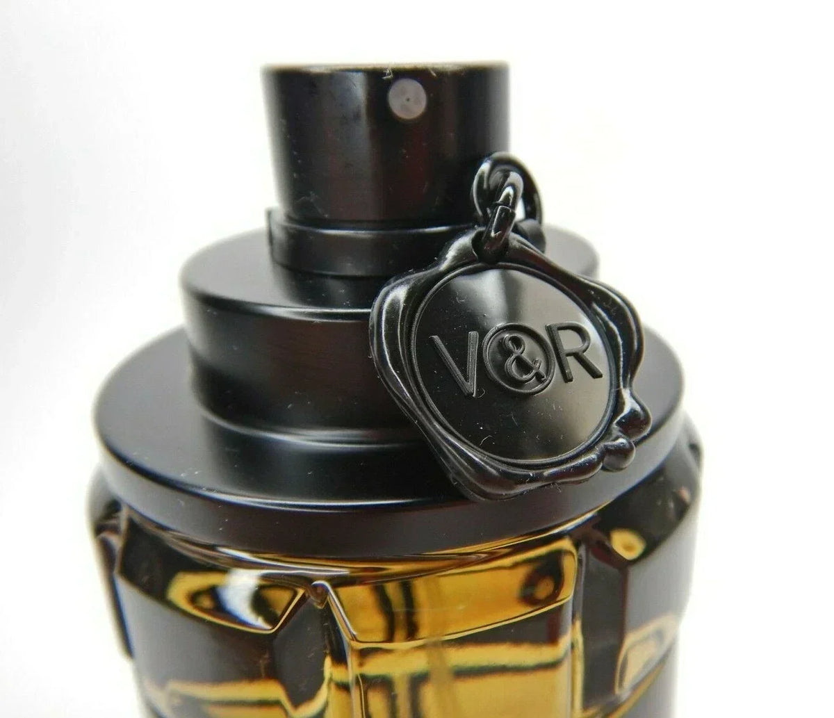 Viktor & Rolf Spicebomb men's fragrance bottle with a dark, textured design, showcasing the luxury perfume from Hub Wavy.